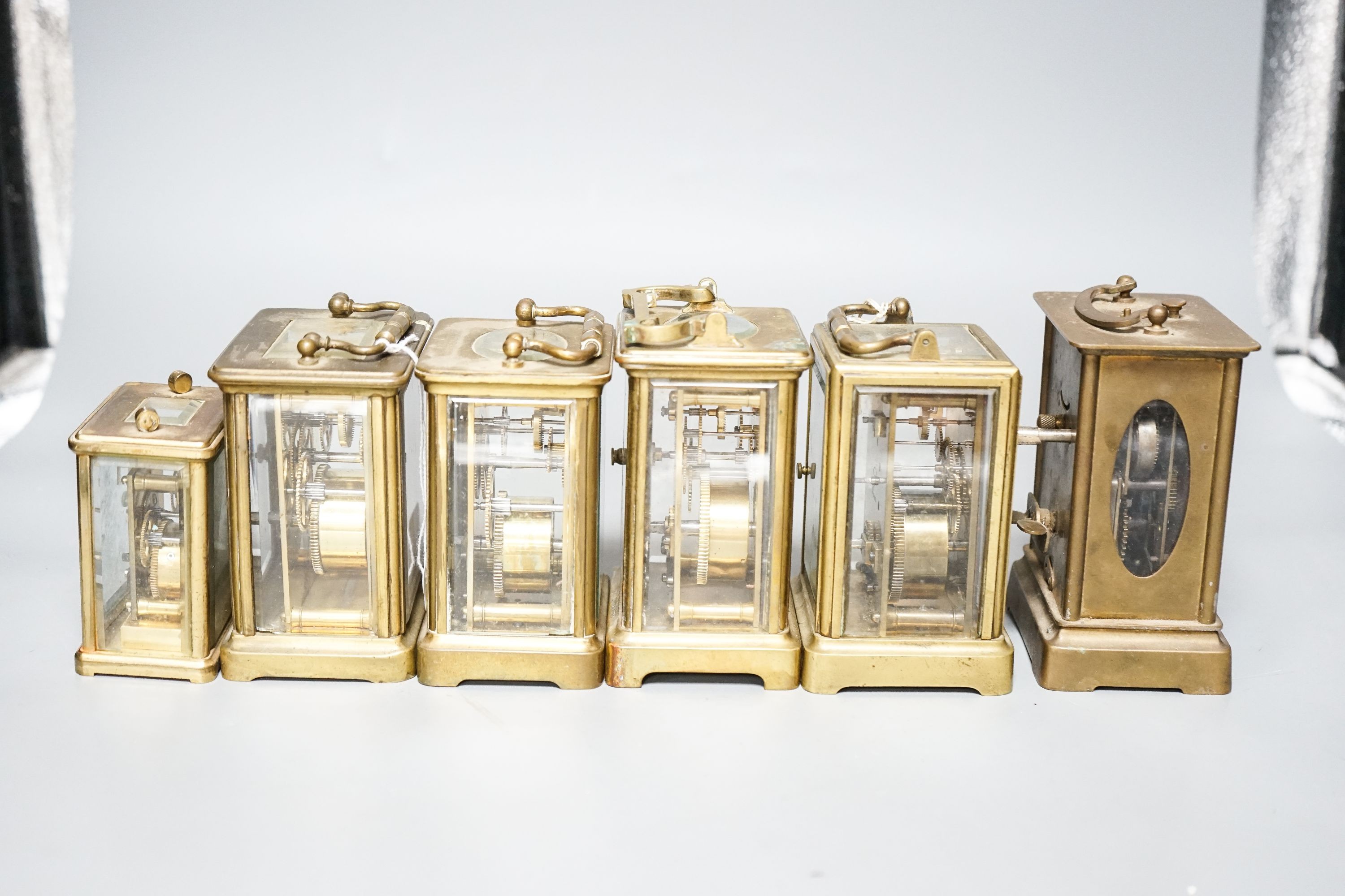 Six assorted carriage timepieces, one with alarm